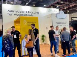 Visitors engaging with Cloud2me exhibition stand at trade show