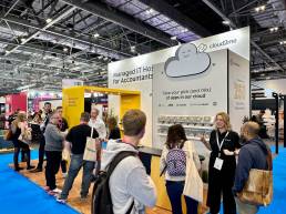 Cloud2me branded exhibition stand with colourful graphics and messaging